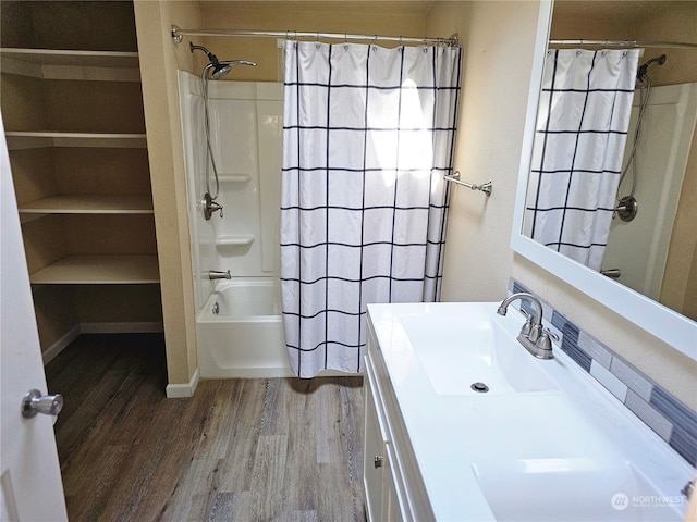 bathroom with vanity, shower / bath combo with shower curtain, and wood-type flooring