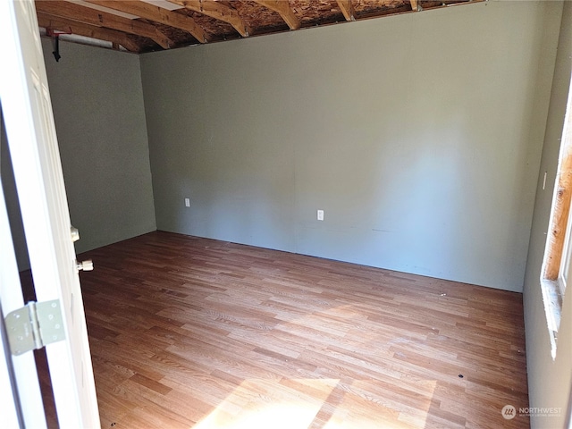 spare room with light hardwood / wood-style flooring