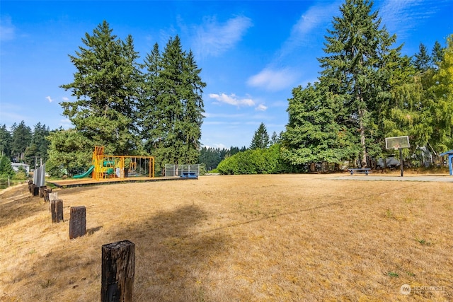 view of playground with a lawn