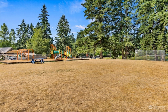 view of community with a playground and a yard