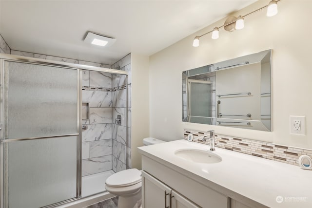 bathroom featuring decorative backsplash, wood-type flooring, toilet, vanity, and an enclosed shower