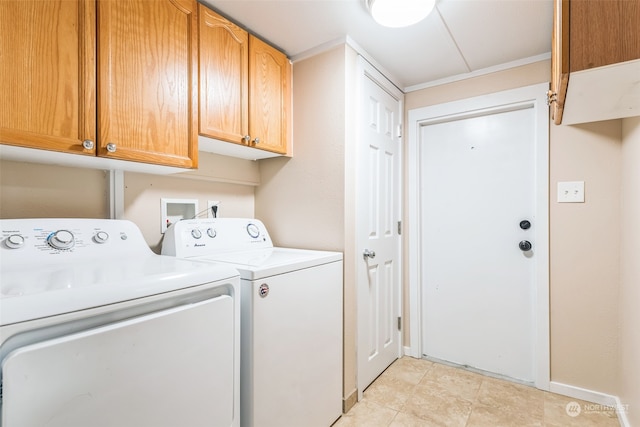 laundry area featuring independent washer and dryer, light tile patterned flooring, and cabinets