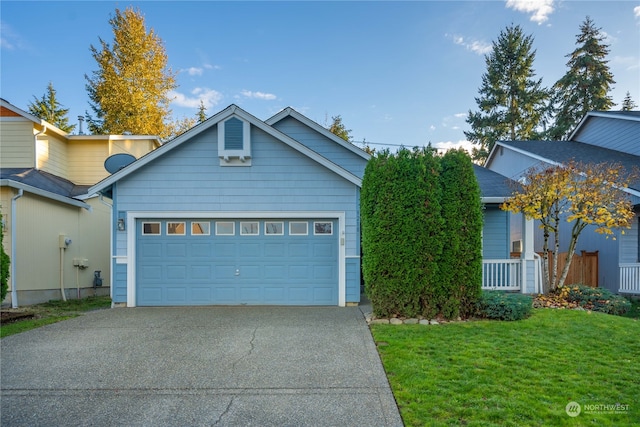 view of front of home featuring a front yard and a garage