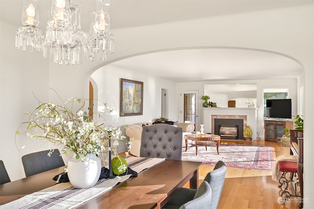 dining room with an inviting chandelier and hardwood / wood-style floors