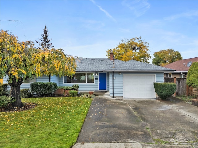 single story home featuring a front lawn and a garage