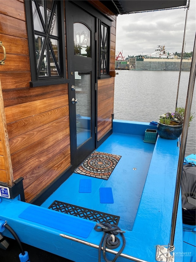 doorway to property with a water view