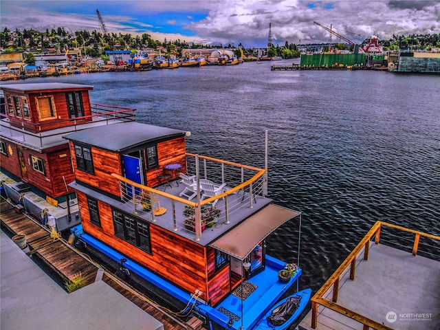 view of dock featuring a water view and a balcony