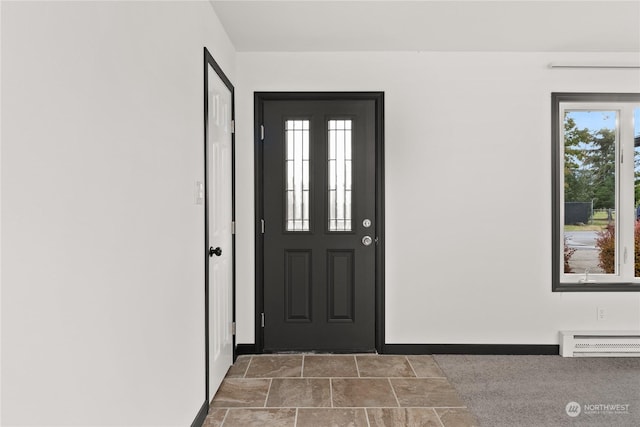 entryway with a baseboard radiator