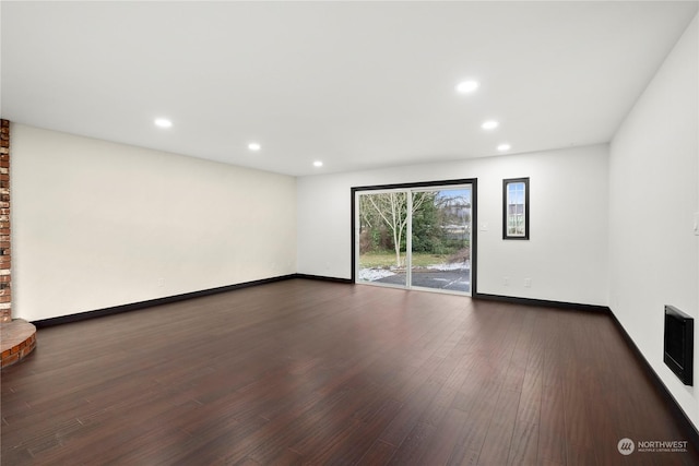 empty room with dark wood-type flooring