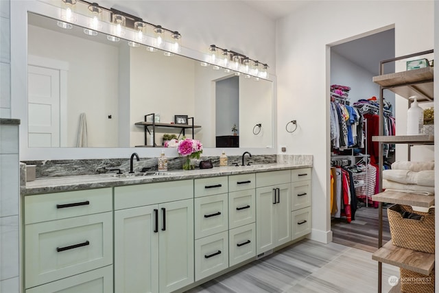 bathroom with vanity and hardwood / wood-style flooring