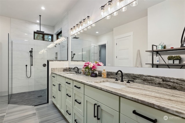 bathroom featuring vanity and a tile shower