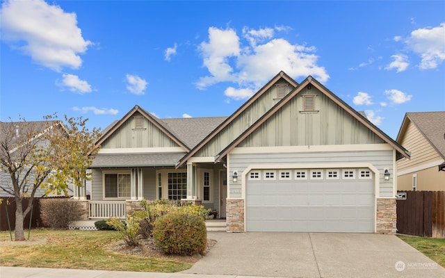 craftsman house with a porch and a garage