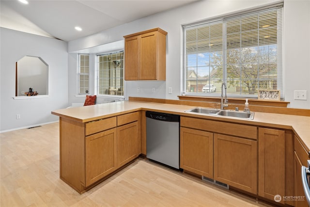 kitchen featuring sink, light hardwood / wood-style flooring, kitchen peninsula, and dishwasher