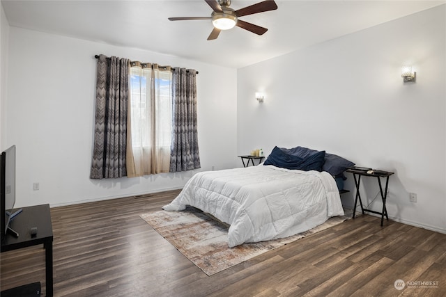 bedroom featuring dark hardwood / wood-style floors and ceiling fan