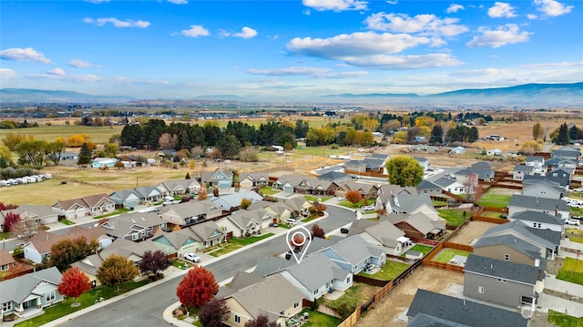 birds eye view of property featuring a mountain view