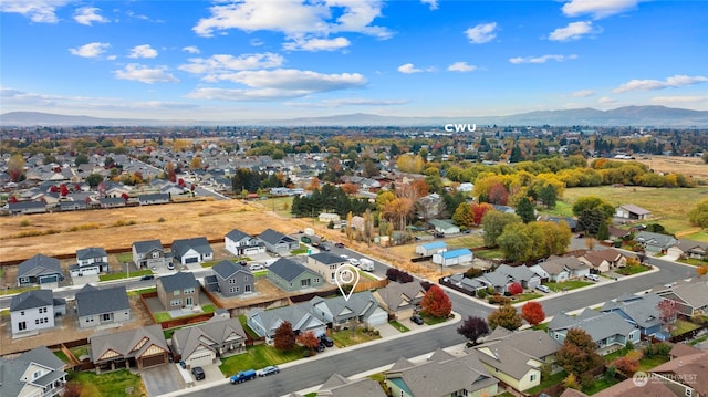 drone / aerial view featuring a mountain view