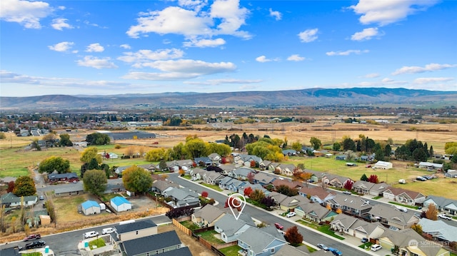 birds eye view of property with a mountain view