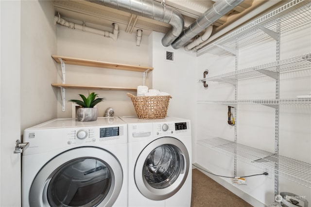 laundry area with independent washer and dryer