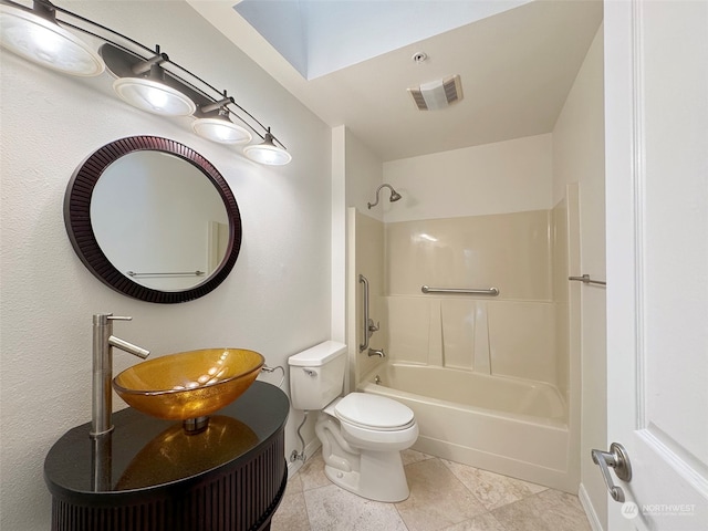 full bathroom featuring toilet, tile patterned flooring, sink, and shower / washtub combination