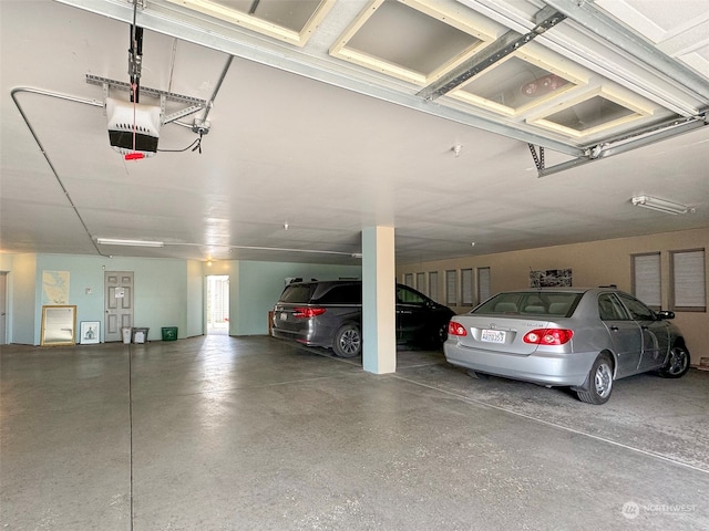 garage featuring a garage door opener