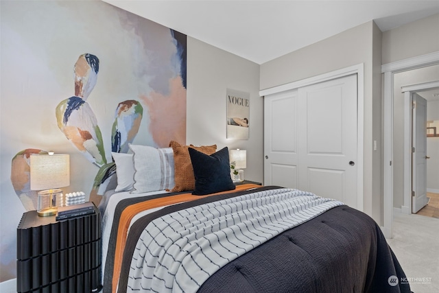 carpeted bedroom with a closet