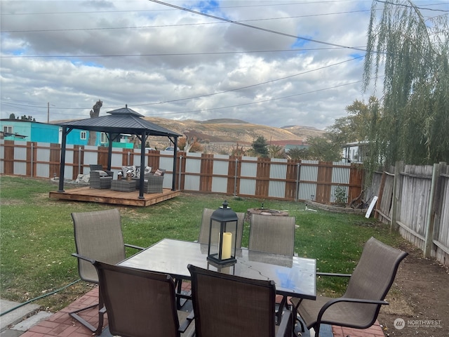 view of patio with a gazebo and a mountain view