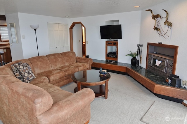 1399 Ocean Shores Blvd SW Unit 2N-E, Ocean Shores, WA 98569 - carpeted living room featuring arched walkways