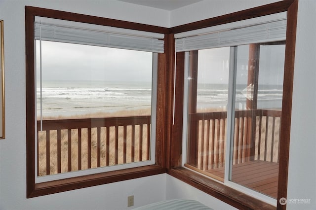 1399 Ocean Shores Blvd SW Unit 2N-E, Ocean Shores, WA 98569 - unfurnished sunroom featuring view of water and beach