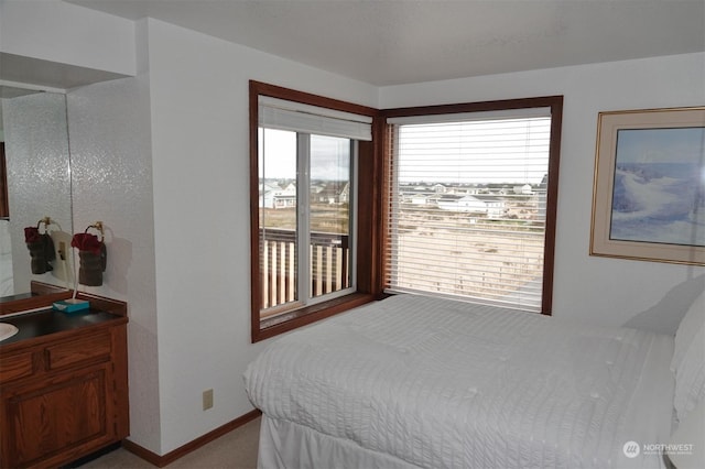 1399 Ocean Shores Blvd SW Unit 2N-E, Ocean Shores, WA 98569 - bedroom featuring light colored carpet and baseboards
