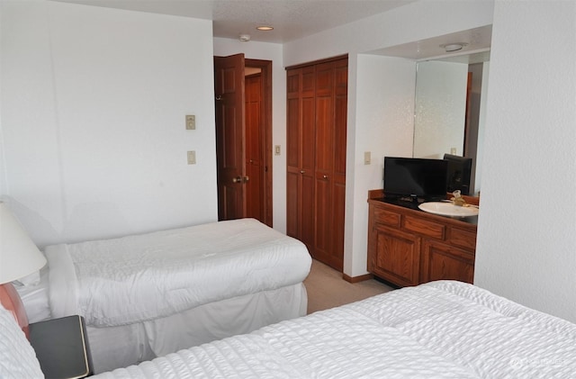 1399 Ocean Shores Blvd SW Unit 2N-E, Ocean Shores, WA 98569 - bedroom with light carpet and a closet