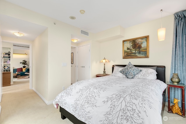 bedroom featuring light colored carpet