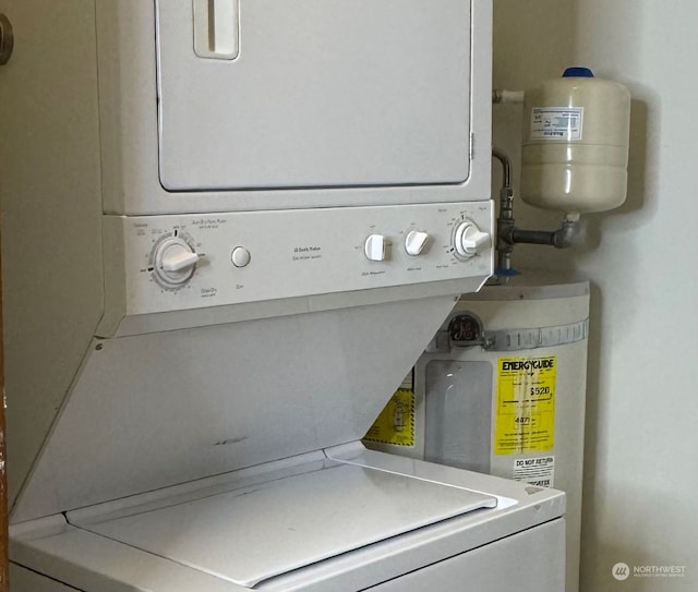 washroom featuring stacked washer / drying machine