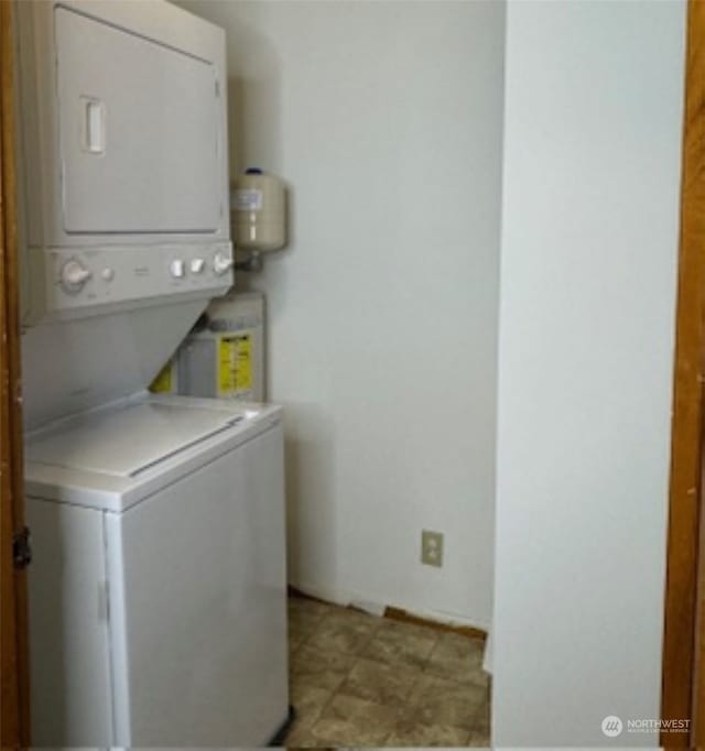 laundry area with stacked washer and clothes dryer