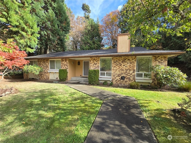 ranch-style house with a front lawn