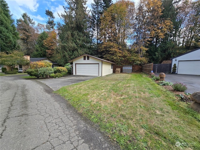 garage featuring a lawn