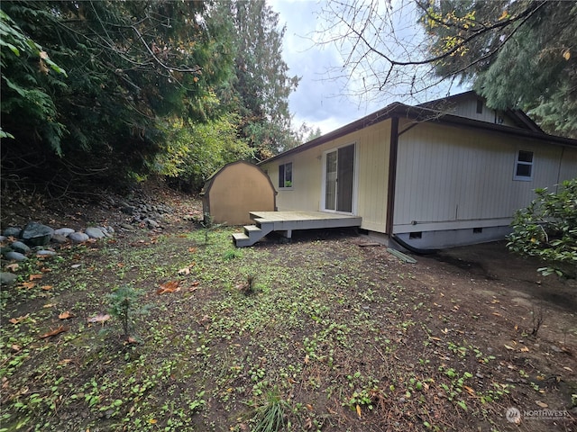 view of property exterior with a deck