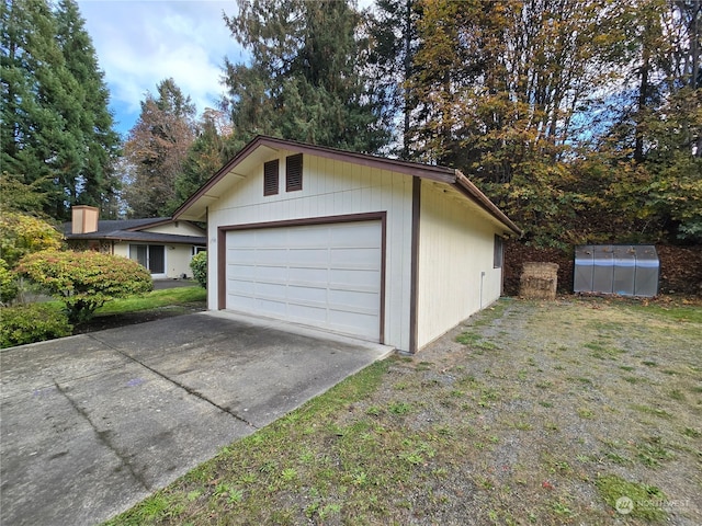 garage with a yard