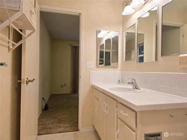 bathroom featuring vanity and tile patterned flooring