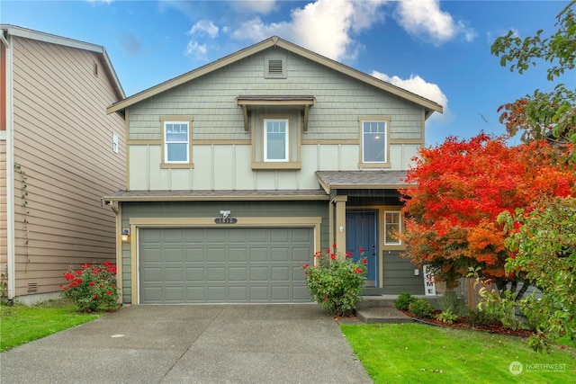 view of front of property with a garage