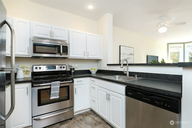 kitchen featuring white cabinetry, appliances with stainless steel finishes, and sink