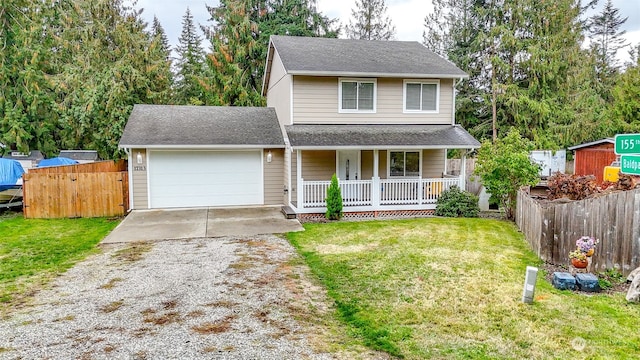 view of front property with a front yard, a porch, and a garage