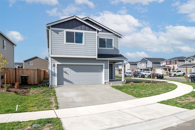 view of front of house featuring a front yard and a garage