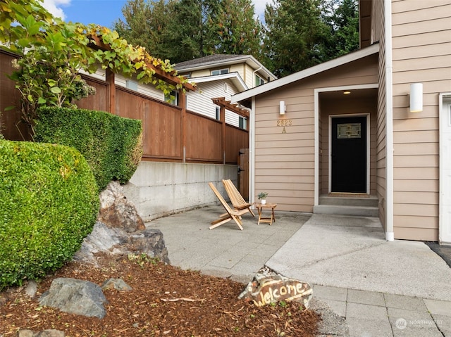 property entrance with a patio