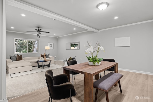 dining area with ceiling fan, ornamental molding, and light hardwood / wood-style flooring