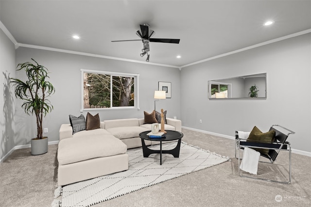 living room featuring ornamental molding, light colored carpet, and ceiling fan