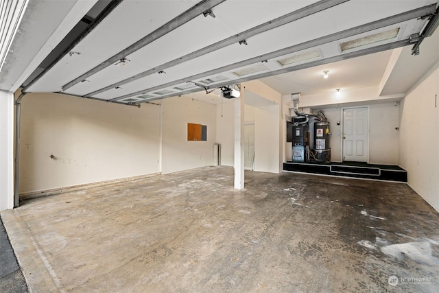 garage featuring secured water heater and a garage door opener