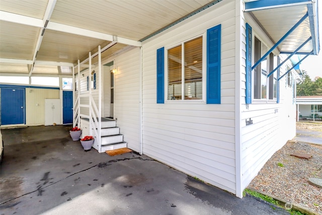 view of side of property with a carport