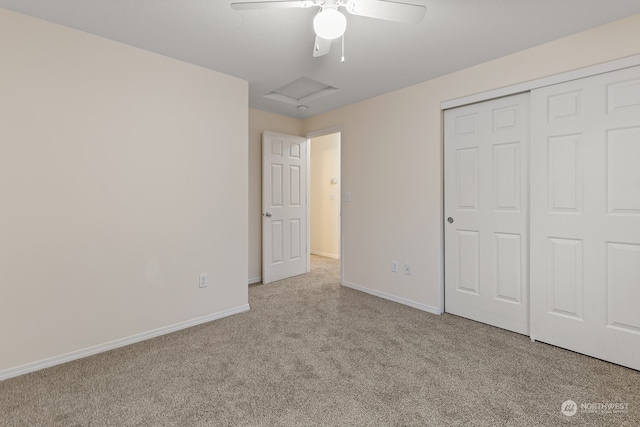 unfurnished bedroom with light colored carpet, ceiling fan, and a closet