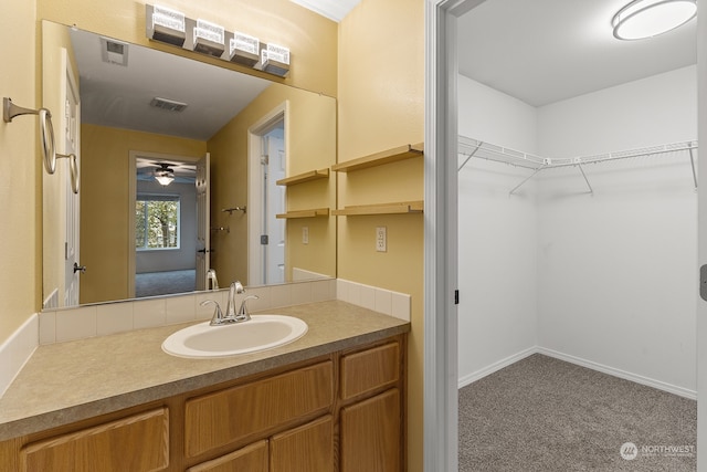 bathroom featuring vanity and ceiling fan