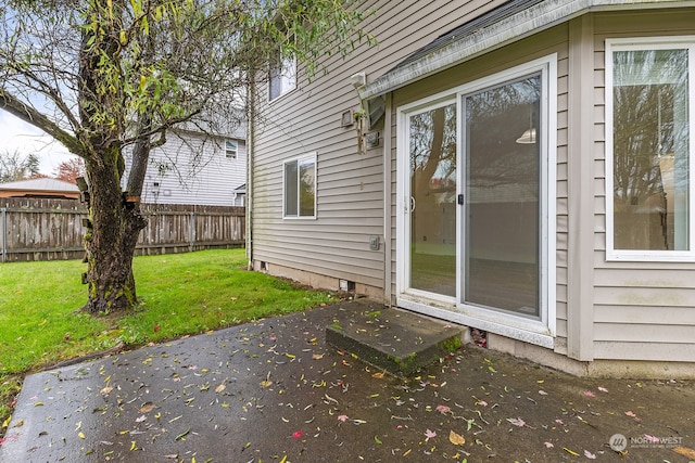 view of home's exterior featuring a patio and a yard